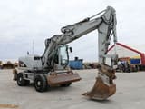 2009 Caterpillar M313D wheel excavator, side profile view