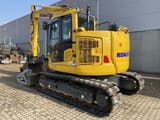 2023 Komatsu PC138US-11 crawler excavator, rear three-quarter view