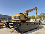 2018 Caterpillar 320CL amphibious excavator, rear three-quarter view