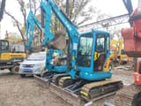2023 Kubota KX135-3S mini excavator, front three-quarter view