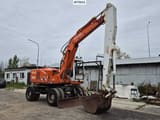 1995 Atlas 1404 wheel excavator, side profile view