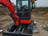 Kubota U25 Mini Excavator, front three-quarter view