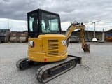 2021 Caterpillar 303.5E mini excavator, rear three-quarter view
