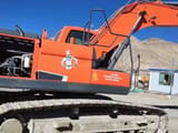 Doosan DX220LC-9 excavator, side view with engine compartment open