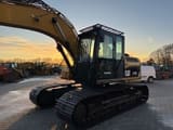 2010 Caterpillar 319DL crawler excavator, side view