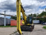 2011 Caterpillar M318D MH material handler, front view