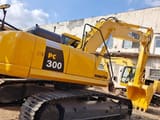 2024 Komatsu PC300 crawler excavator, rear three-quarter view