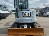 2017 Caterpillar 305E2 mini excavator, front view with blade