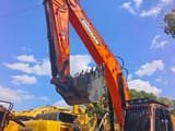 2024 Doosan DX225LC-3 crawler excavator, side view of boom and bucket