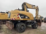 2013 Caterpillar M316D wheel excavator, rear three-quarter view