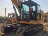 2022 Caterpillar 320GC crawler excavator, front three-quarter view