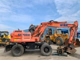 2003 Kobelco EX135W wheel excavator, side view