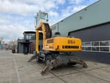 2010 Liebherr A924C material handler, rear three-quarter view