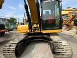 2021 Caterpillar 320GC crawler excavator, front view of cab and tracks