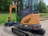 2022 CASE CX26C mini excavator, rear three-quarter view
