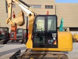 2023 Caterpillar 305.5E mini excavator, side profile view