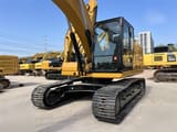 2023 Caterpillar 323 crawler excavator, front three-quarter view