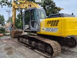2005 New Holland E215 crawler excavator, rear three-quarter view