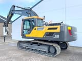 2025 Volvo EC220D crawler excavator with hydraulic hammer, side view