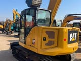 2024 Caterpillar 307.5 mini excavator, rear three-quarter view