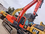 2017 Doosan DX140 excavator, side view