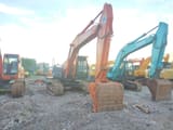 Hitachi ZX210 crawler excavator, front three-quarter view