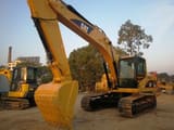 2023 Caterpillar 320C crawler excavator, front three-quarter view