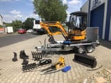 Berger Kraus BK1700JS mini excavator on trailer with attachments