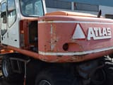 2001 Atlas 1404 M wheel excavator rear three-quarter view