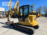 2024 Caterpillar 305 CR mini excavator, rear three-quarter view