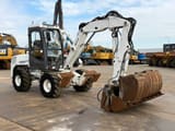 2013 Mecalac 12MXT wheel excavator, side view