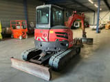 2015 Kubota U48-4 mini excavator, rear three-quarter view