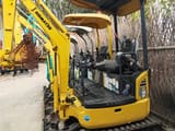 2023 Komatsu PC18MR-3 mini excavator, side view of open operator station
