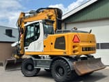 2015 Liebherr A914 wheel excavator, rear three-quarter view