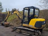 2001 Caterpillar 304.5 mini excavator, rear three-quarter view