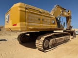 2022 Caterpillar 395 crawler excavator, rear three-quarter view