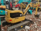 Caterpillar 301.7 CR mini excavator, rear three-quarter view