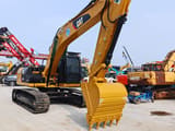 2024 Caterpillar 323D crawler excavator, front three-quarter view