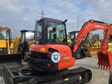 2023 Kubota U55-4 mini excavator, front three-quarter view