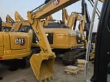 2025 Caterpillar 307 mini excavator, rear three-quarter view