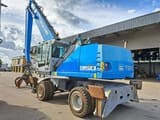 2011 Fuchs MHL350E material handler, rear three-quarter view
