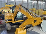 2024 Caterpillar 305.5E2 mini excavator, front three-quarter view