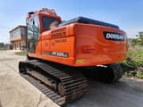 2020 Doosan DX225LC crawler excavator, rear three-quarter view