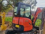 Kubota U-30 mini excavator, side view
