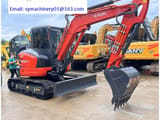 2023 Kubota KX057-4 mini excavator, side view