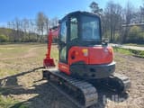 2023 Kubota KX057-4 crawler excavator, rear three-quarter view