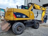 2009 Caterpillar M315D wheel excavator, rear three-quarter view