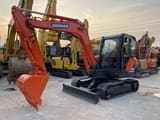 2023 Doosan DX60-9C mini excavator, front three-quarter view