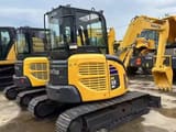 2024 Komatsu PC-55MR mini excavator, rear three-quarter view