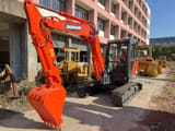 2023 Doosan DX60-9C mini excavator, front three-quarter view